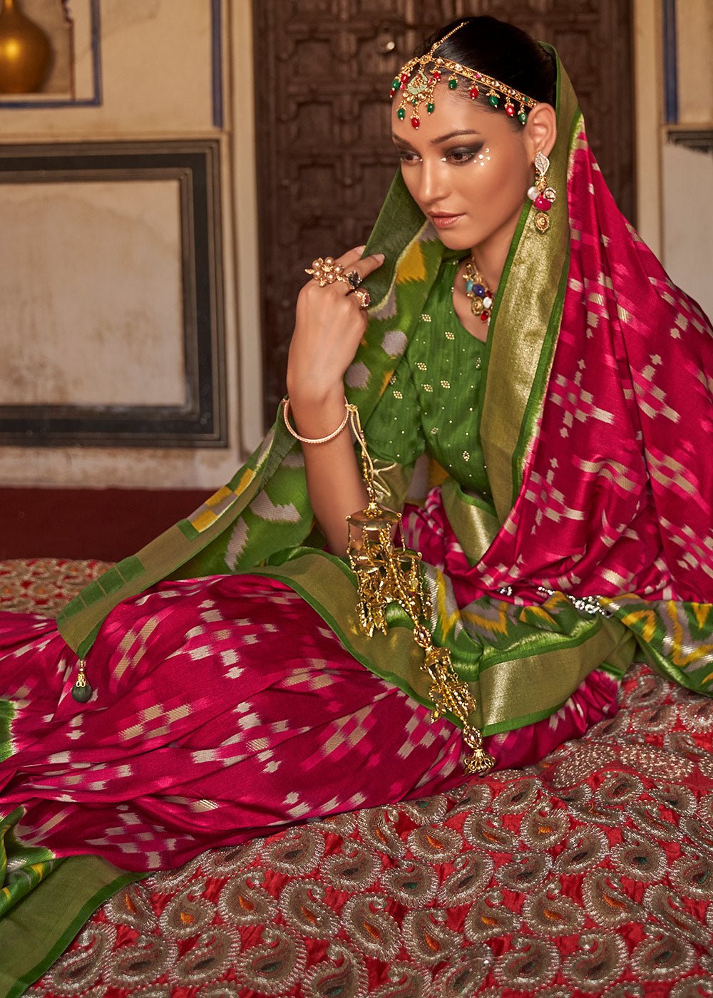 Patola green and red dola silk saree with elegant zari border - Image 2