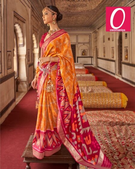 Patola orange pink printed saree featuring ethnic motifs and zari border