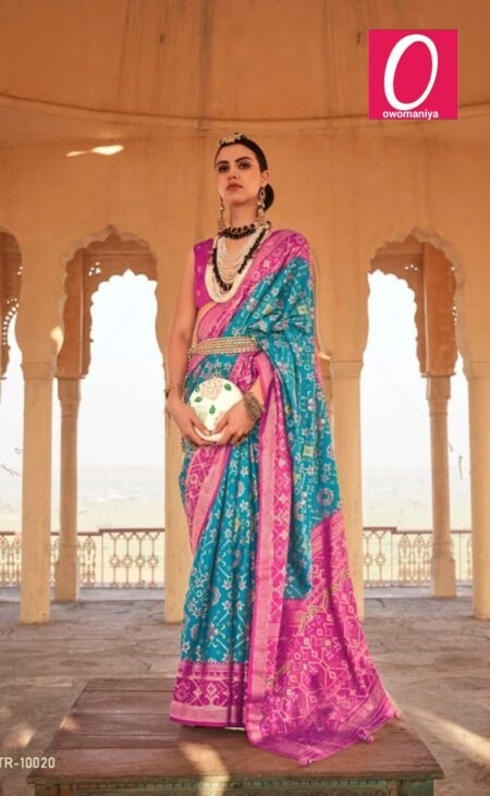 Patola sea blue designer silk saree with contrasting magenta pink blouse