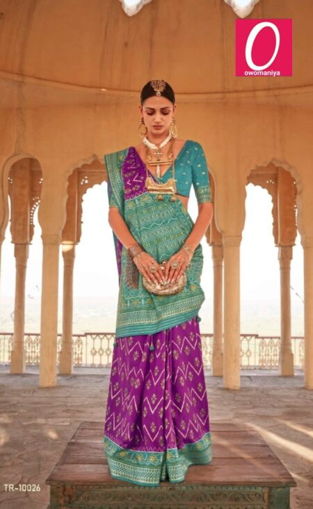 Patola vibrant purple silk saree with sea green contrast border and unstitched blouse