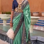Patola Silk Saree in Turquoise Zari Weaving with Blue Border & Unstitched Blouse